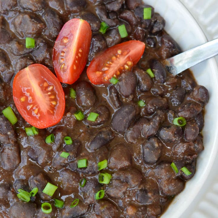 Learn how to make the best Seasoned Black Beans! This healthy, easy black bean recipe includes canned black beans simmered in spices. This recipe is great for tacos, salads, burritos and more!