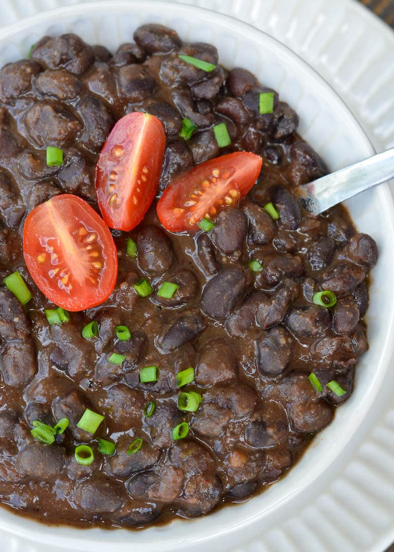 Learn how to make the best Seasoned Black Beans! This healthy, easy black bean recipe includes canned black beans simmered in spices. This recipe is great for tacos, salads, burritos and more!