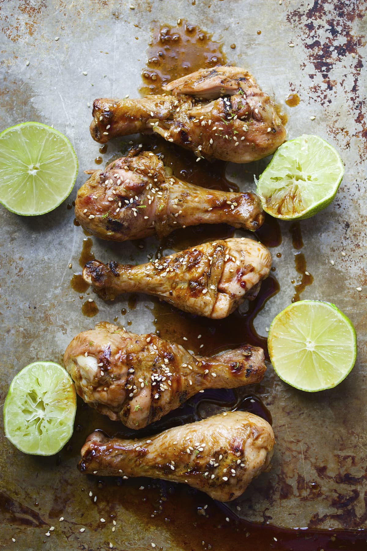 Smoked Drumsticks with Sriracha Honey Lime Sauce are loaded with flavor! These drumsticks are ready in under 30 minutes and totally gluten free!