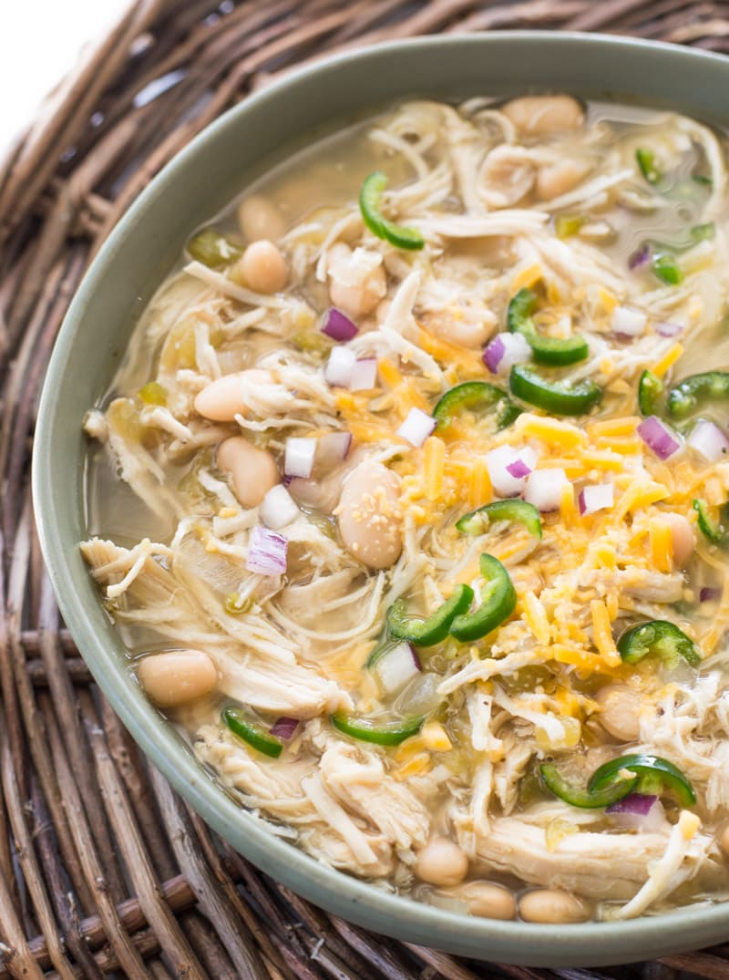 Using your Slow Cooker makes this White Bean Chicken Chili  a cinch! Just toss in your ingredients, and let it simmer all day! Come home to a warm, filling bowl of soup!