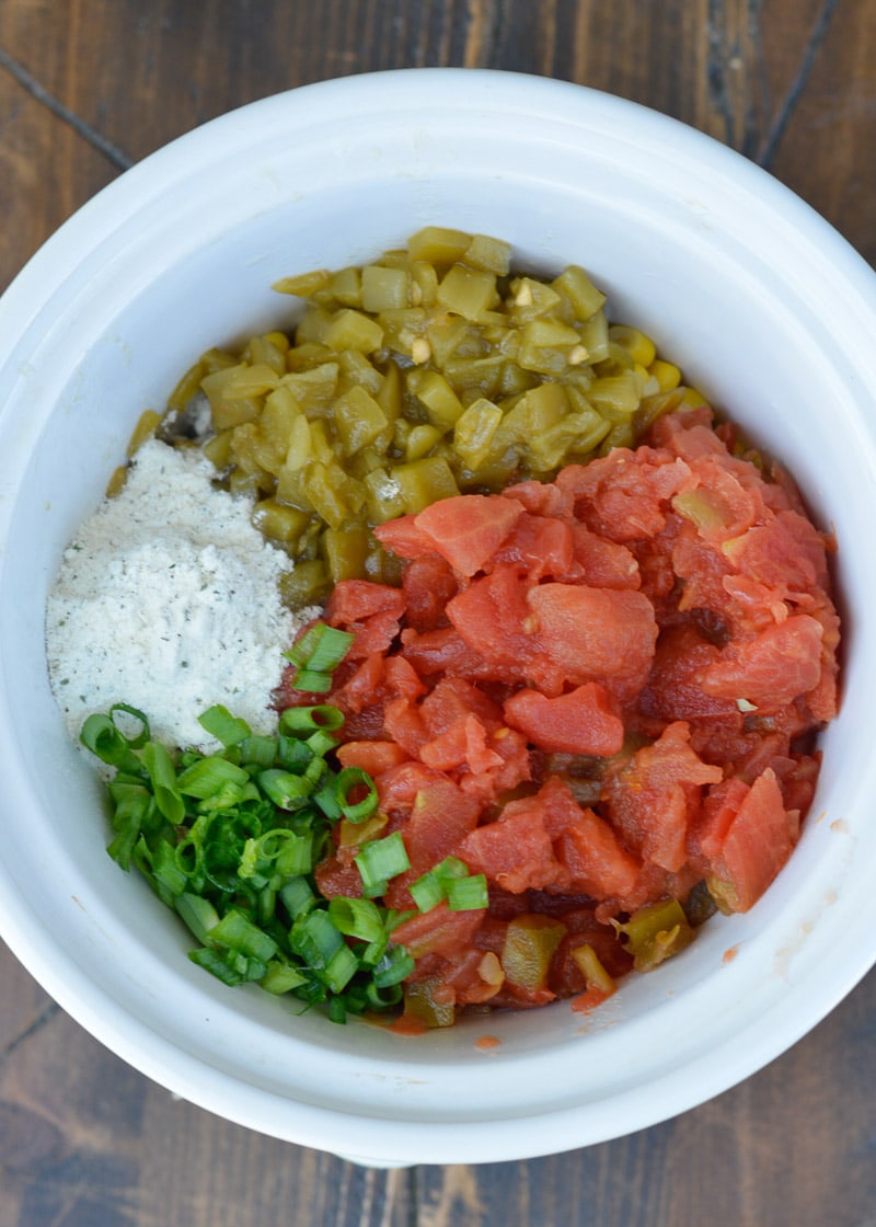 Slow Cooker Corn Dip makes for an impressive appetizer without any work! Just toss your ingredients in the slow cooker and come home to a creamy, cheesy dip!