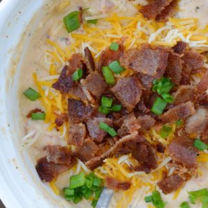 Slow Cooker Corn Dip makes for an impressive appetizer without any work! Just toss your ingredients in the slow cooker and come home to a creamy, cheesy dip!