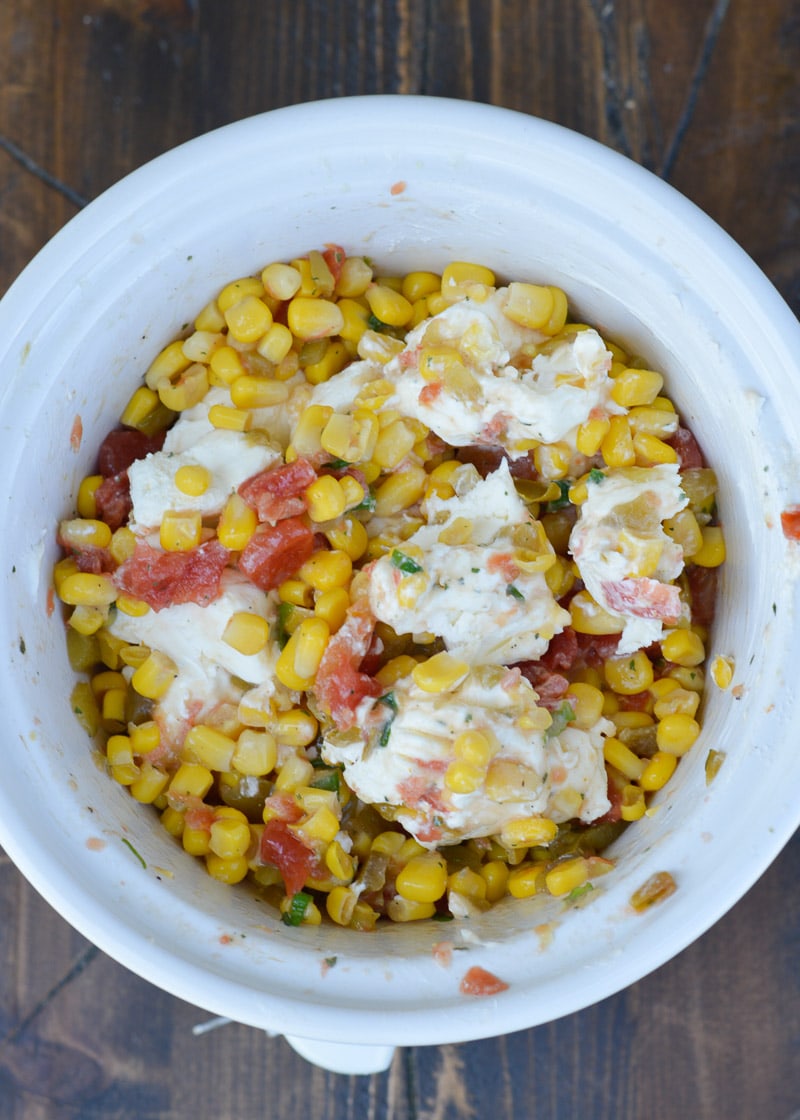 Slow Cooker Corn Dip makes for an impressive appetizer without any work! Just toss your ingredients in the slow cooker and come home to a creamy, cheesy dip!