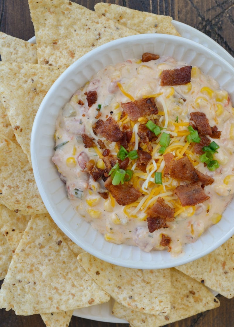 Slow Cooker Corn Dip makes for an impressive appetizer without any work! Just toss your ingredients in the slow cooker and come home to a creamy, cheesy dip!