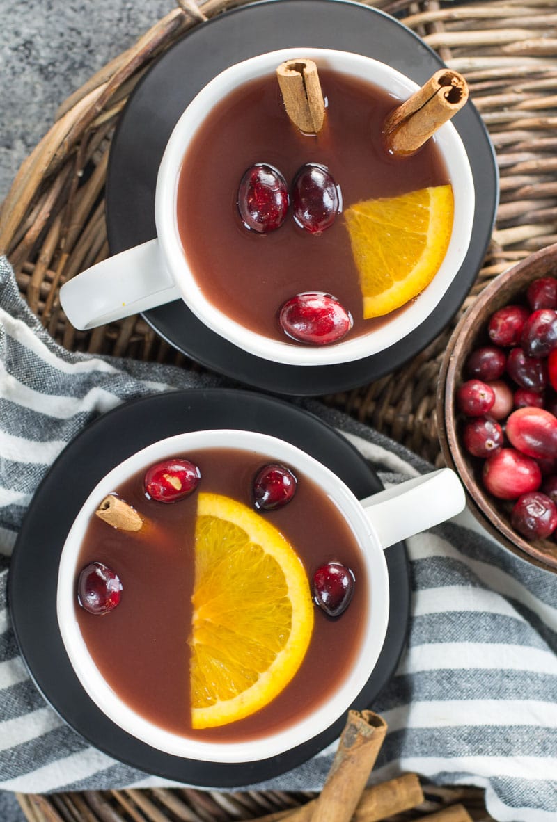  This Cranberry Pineapple Tea is full of mulled spices like cinnamon and cloves along with fresh fruit. This festive tea is essential for holiday entertaining!