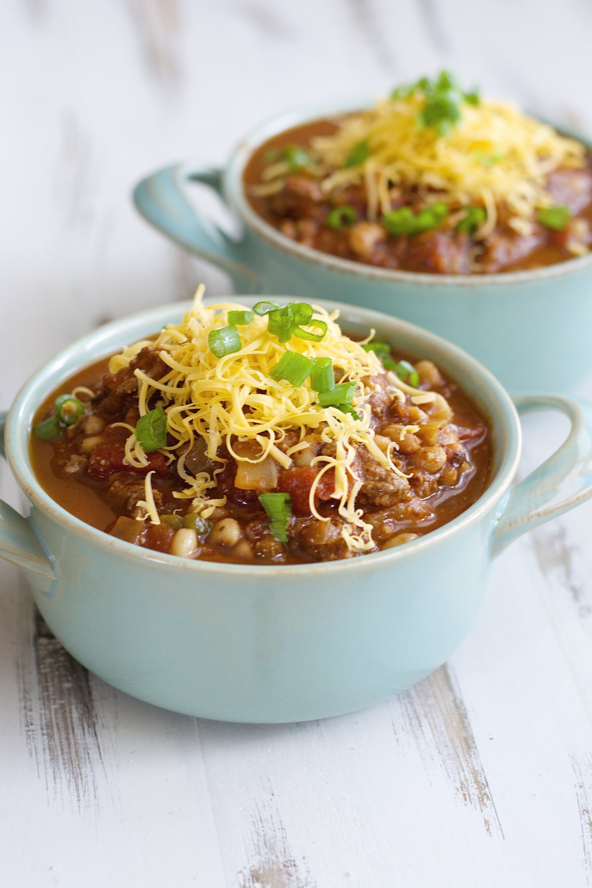 This Cabbage and Black-Eyed Pea Soup is the perfect slow cooker soup recipe for New Year's Day! Packed with black-eyed peas, onions, bell pepper, cabbage, and tomatoes for an easy, comforting soup.