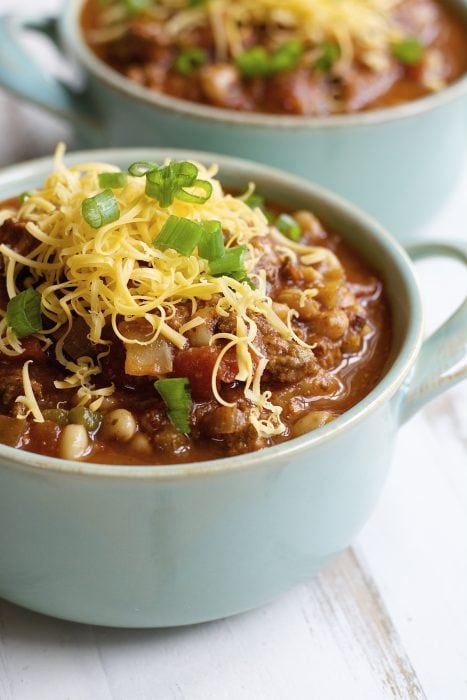 cabbage and black eyed pea soup in two blue soup dishes 