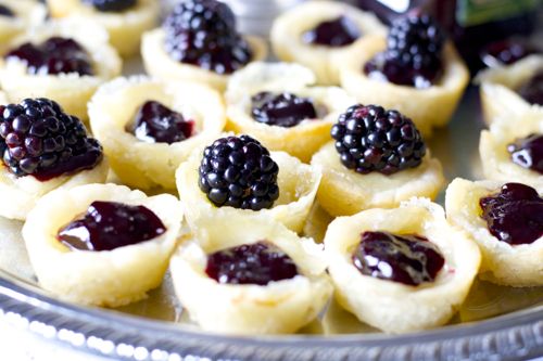 baked brie appetizer bites on a silver tray