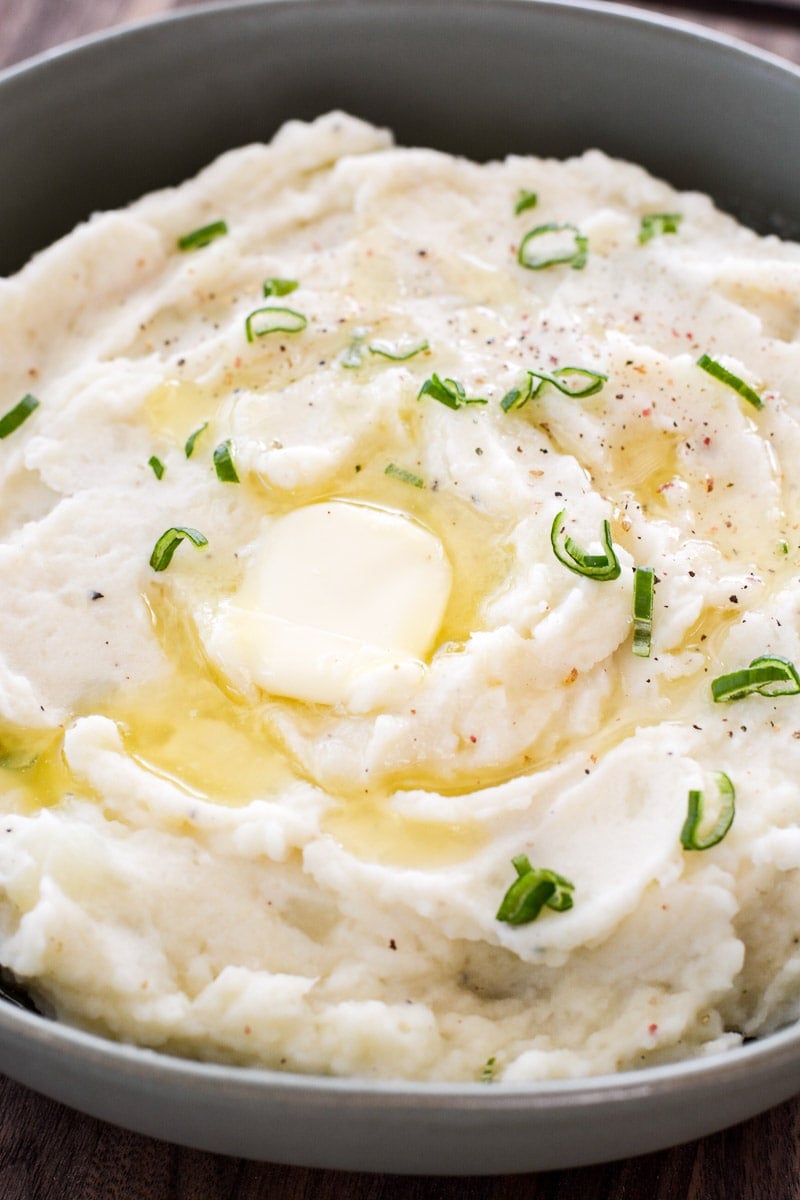 homemade mashed potatoes in a gray bowl