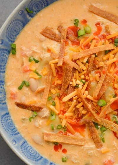 This Slow Cooker Buffalo Chicken Chili is loaded with shredded chicken, white beans, vegetables, sharp cheddar cheese and tangy buffalo sauce!