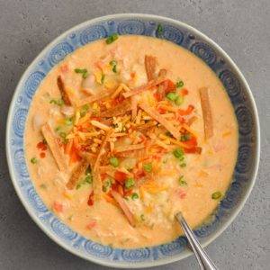 This Slow Cooker Buffalo Chicken Chili is loaded with shredded chicken, white beans, vegetables, sharp cheddar cheese and tangy buffalo sauce!