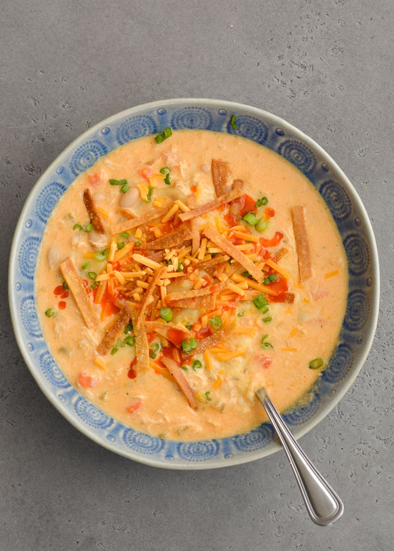 This Slow Cooker Buffalo Chicken Chili is loaded with shredded chicken, white beans, vegetables, sharp cheddar cheese and tangy buffalo sauce!