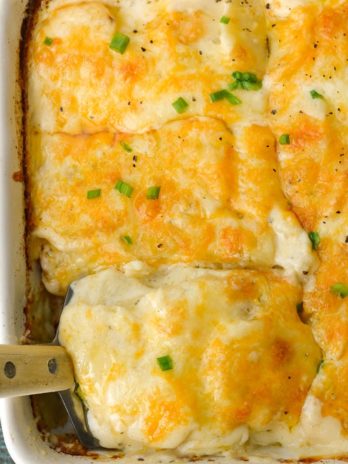 Thinly sliced potatoes are paired with a creamy cheesy ranch sauce in the perfect Cheddar Ranch Au Gratin Potatoes recipe!