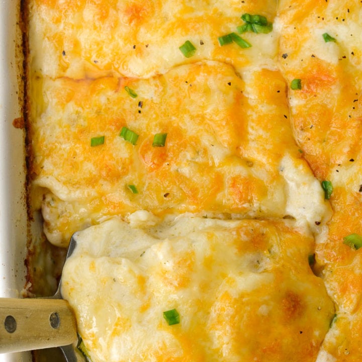 Thinly sliced potatoes are paired with a creamy cheesy ranch sauce in the perfect Cheddar Ranch Au Gratin Potatoes recipe!
