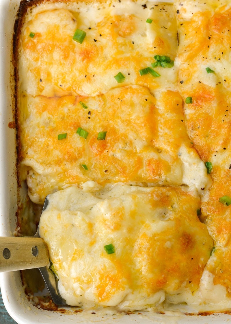 Thinly sliced potatoes are paired with a creamy cheesy ranch sauce in the perfect Cheddar Ranch Au Gratin Potatoes recipe!