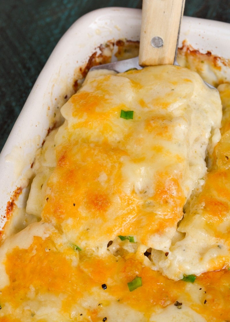 Thinly sliced potatoes are paired with a creamy cheesy ranch sauce in the perfect Cheddar Ranch Au Gratin Potatoes recipe!