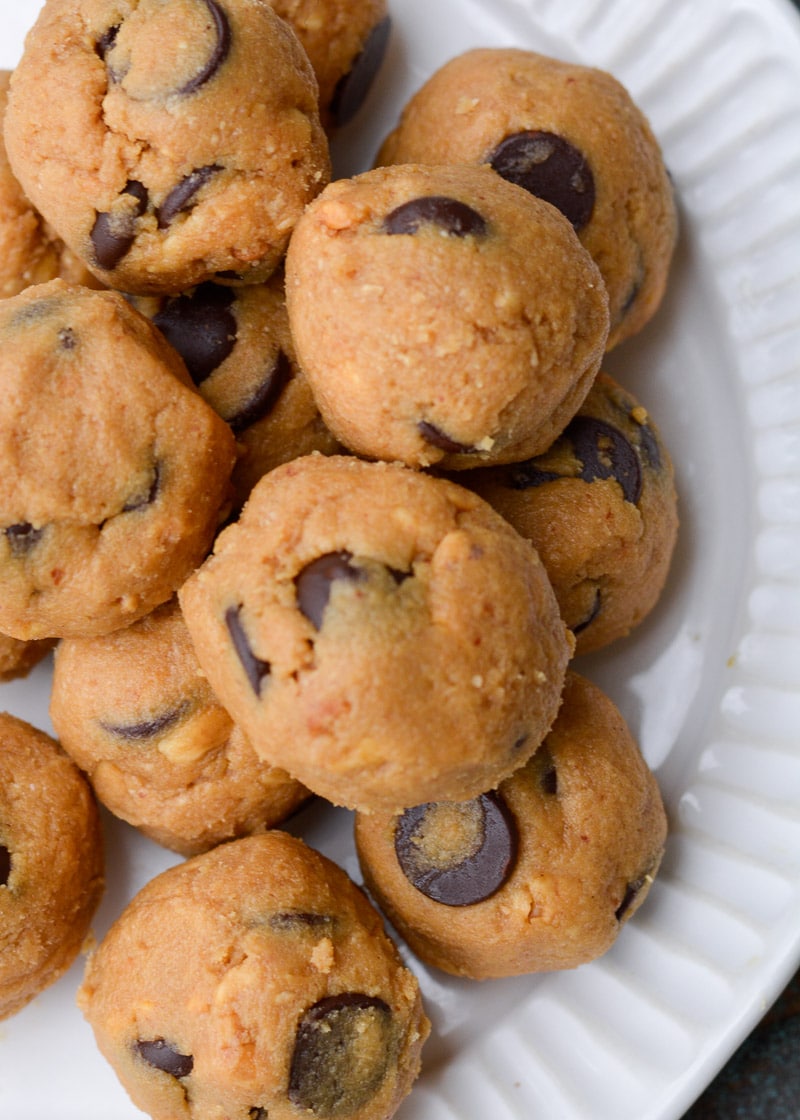 These Chocolate Peanut Butter Balls are the perfect keto snack! Creamy peanut butter is blended with a low carb caramel sauce, protein powder and chocolate chips, making these keto sweets protein packed!