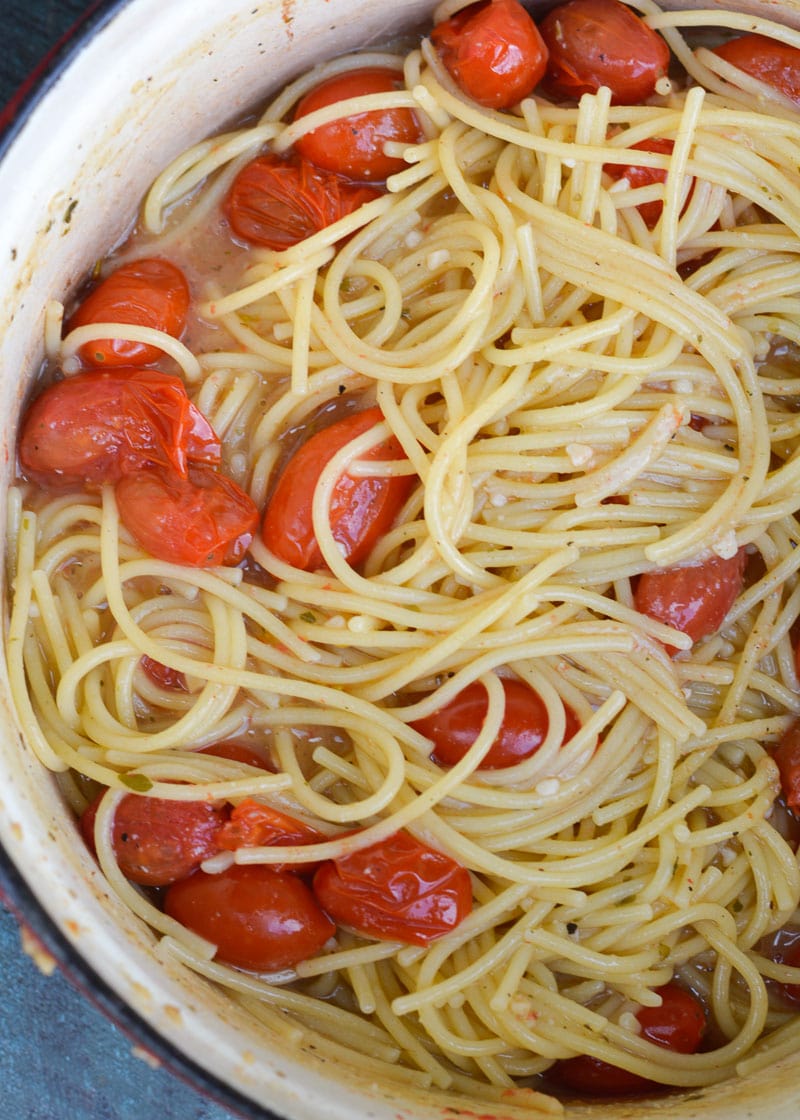 This Garlic Parmesan Pasta is going to become a weeknight favorite! Gluten free pasta is covered in a creamy wine sauce and topped with cherry tomatoes and is ready in only 20 minutes!