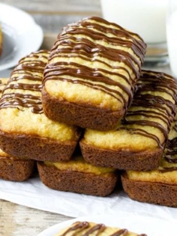 This easy Bisquick Banana Bread is filled with a peanut butter cream and drizzled with melted chocolate! Bake in mini loaf pans to give as gifts, or make one big loaf all for yourself! 