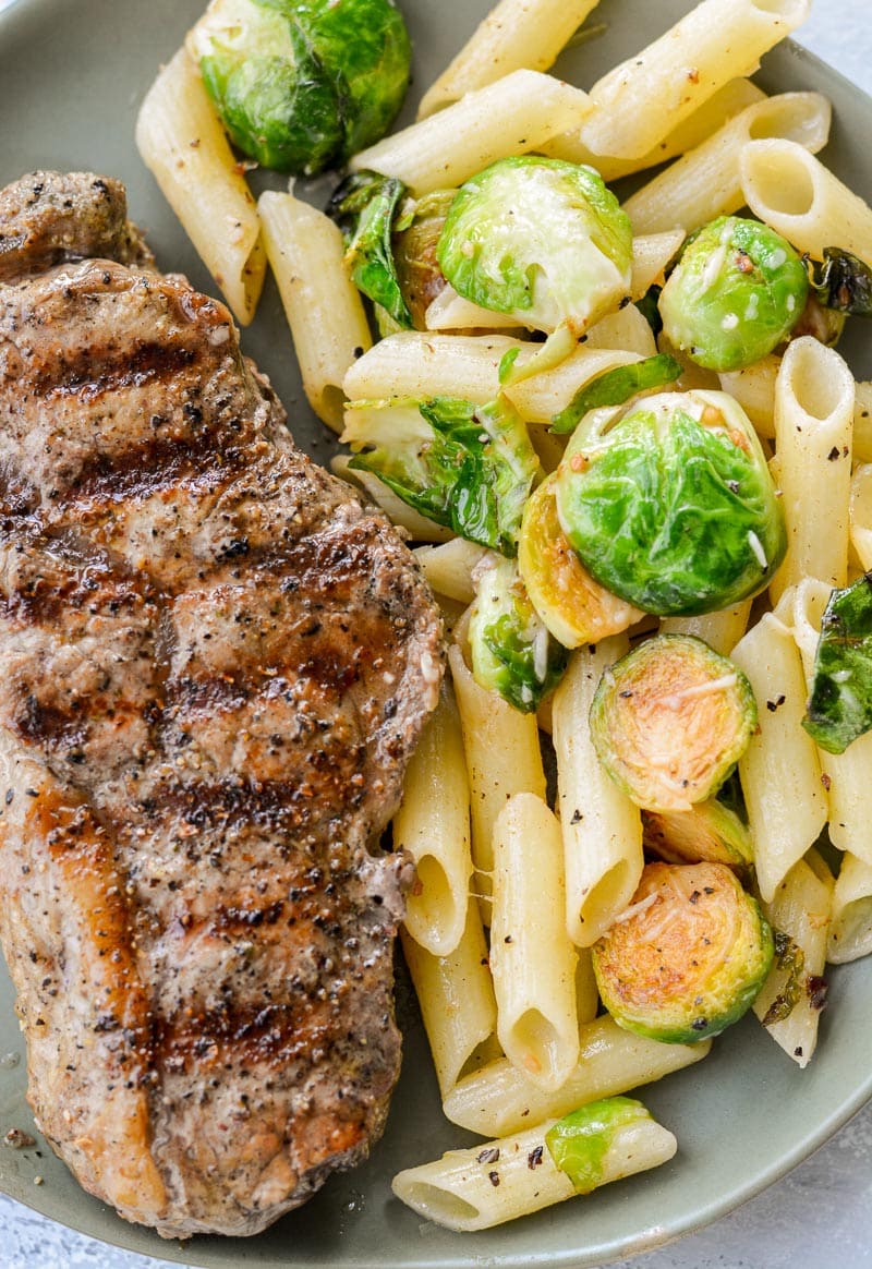 This five ingredient Penne with Brussels Sprouts and Parmesan is swimming in a rich brown butter sauce. The perfect vegetarian meal or quick and easy side dish!