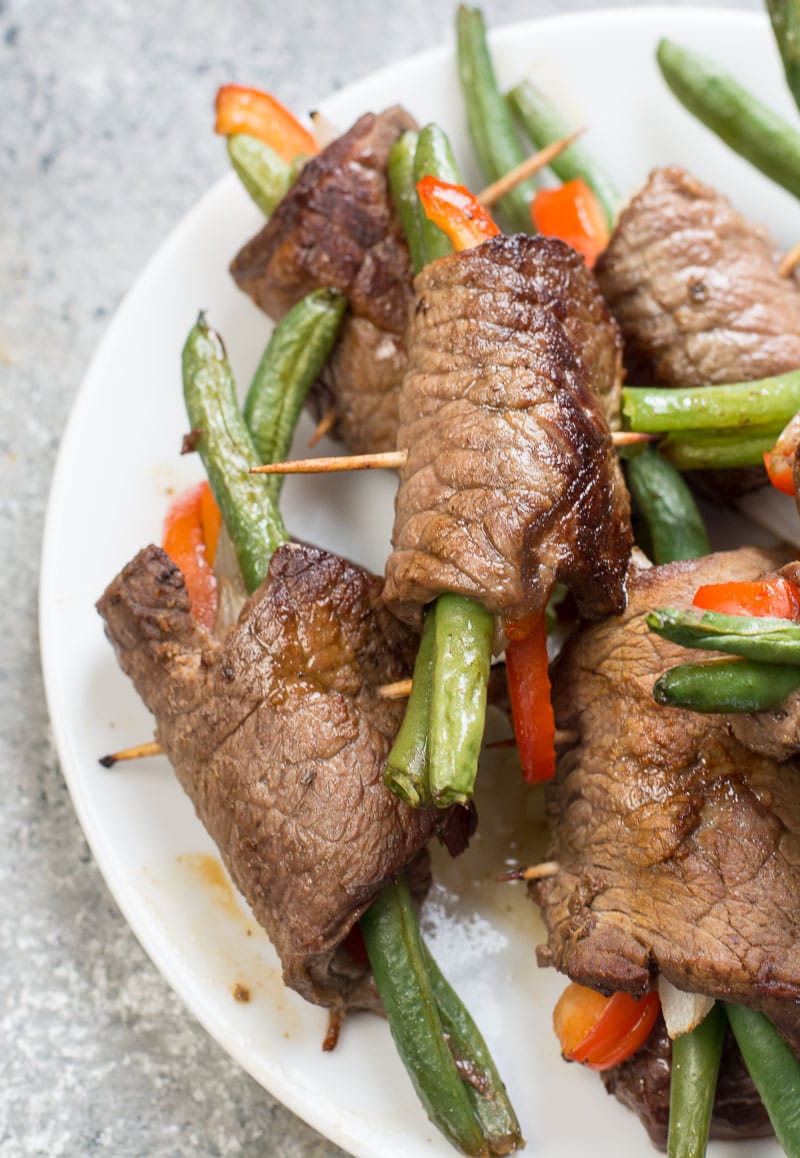 These easy Keto Steak Rolls are loaded with flavor. Flank steak is wrapped around green beans, peppers and onion, just 4 net carbs per serving!