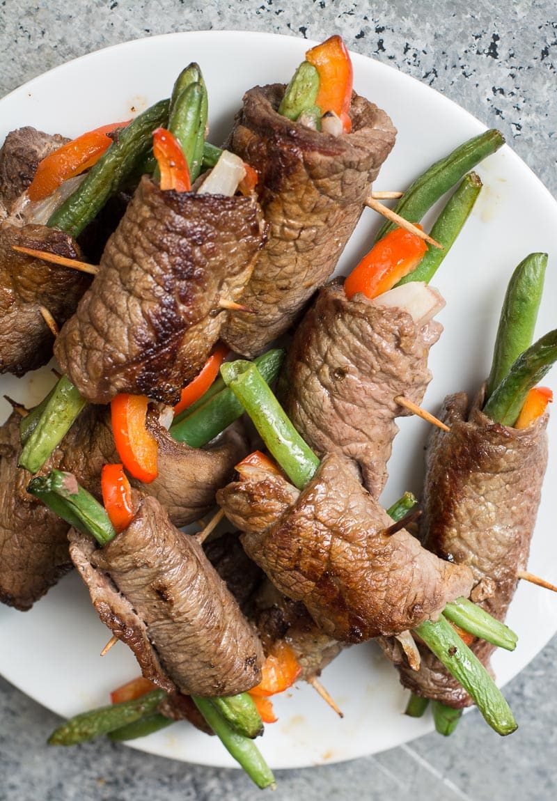 These easy Keto Steak Rolls are loaded with flavor. Flank steak is wrapped around green beans, peppers and onion, just 4 net carbs per serving!