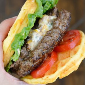 Keto Jalapeño Popper Burgers are the ultimate low carb dinner! Juicy burgers are loaded with creamy jalapeño popper filling and served on crispy chaffle buns!