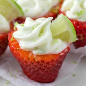 strawberry stuffed with lime cheesecake filling on a table