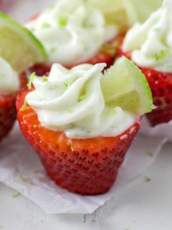 strawberry stuffed with lime cheesecake filling on a table