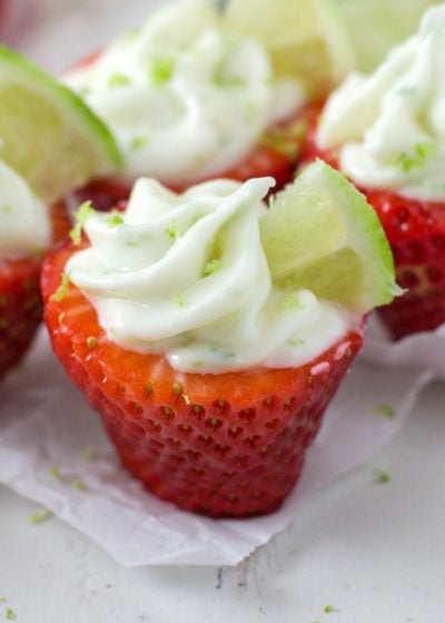 strawberry stuffed with lime cheesecake filling on a table