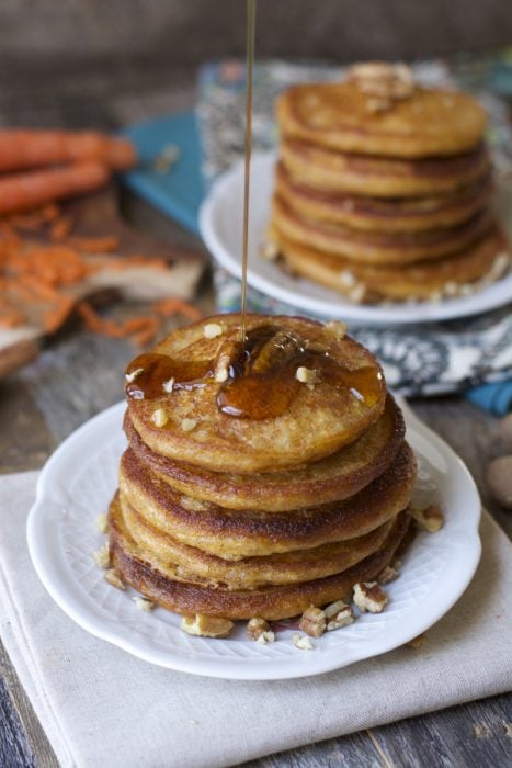 Who said pancakes are unhealthy?! These Carrot Cake Pancakes are packed with fresh carrots, yogurt, ginger, cinnamon, and nutmeg. A delicious and nutritious way to start your morning! 