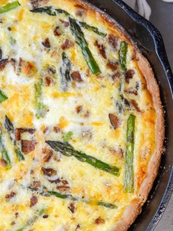 This Asparagus and White Cheddar Quiche is packed with perfectly tender asparagus, salty bacon and sharp cheddar cheese. This easy quiche recipe has options for a low carb, keto friendly crust perfect for a Spring brunch!