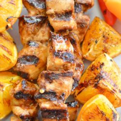 These Orange Sesame Chicken Skewers are loaded with sweet and spicy Asian flavor! Pair with grilled orange wedges for a real treat!