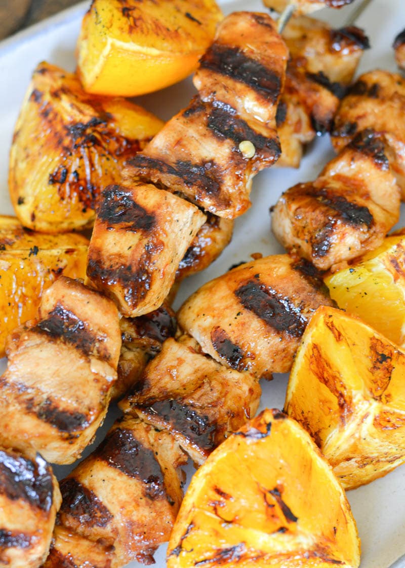 These Orange Sesame Chicken Skewers are loaded with sweet and spicy Asian flavor! Pair with grilled orange wedges for a real treat!