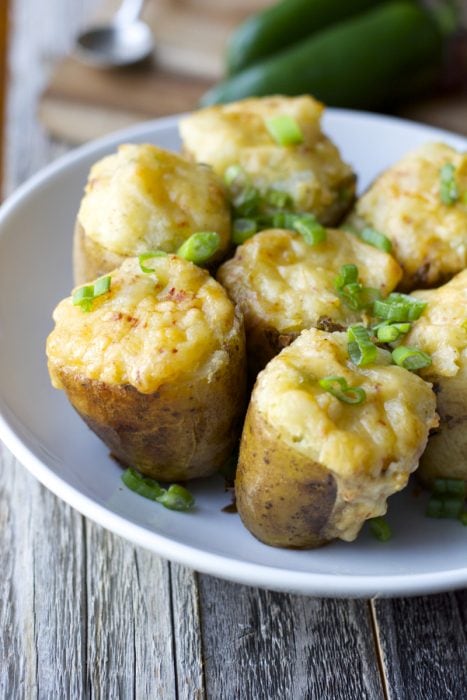 Tender potatoes are packed with chipotle gouda cheese, chopped jalapenos, butter, and sour cream for the ultimate side dish! These Gouda and Jalapeno Twice Baked Potatoes will be a new family favorite!