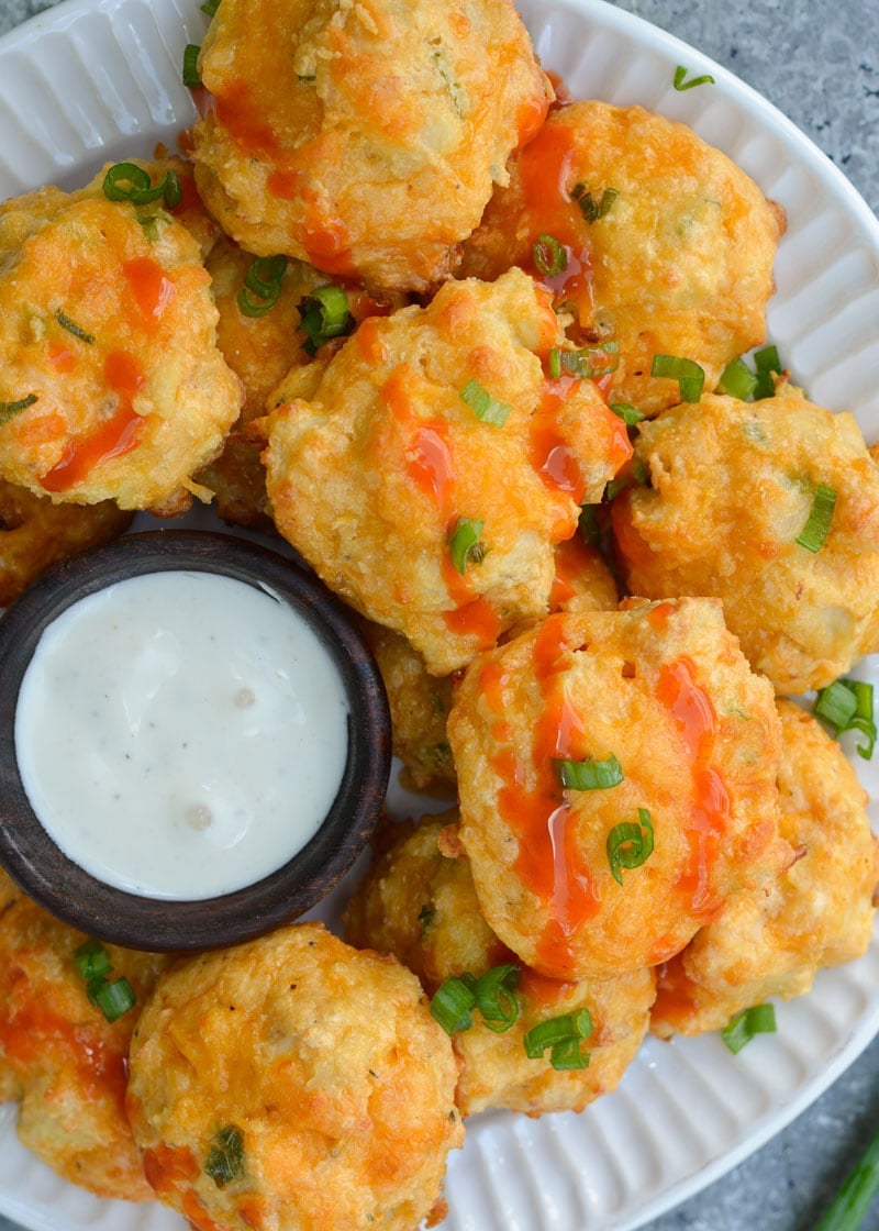 These Cheesy Buffalo Chicken Bites will be a new keto-friendly favorite! Cheesy almond flour bites are packed with spicy Buffalo Chicken for the perfect snack under 1 net carb! 