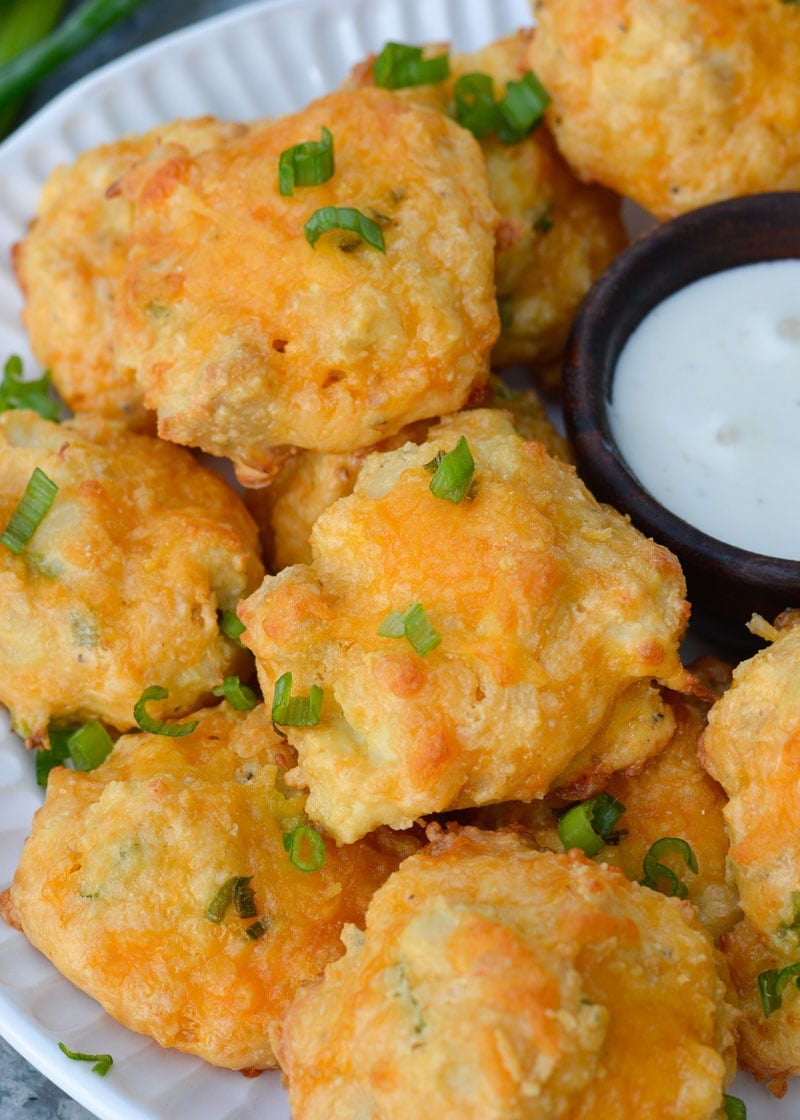 These Cheesy Buffalo Chicken Bites will be a new keto-friendly favorite! Cheesy almond flour bites are packed with spicy Buffalo Chicken for the perfect snack under 1 net carb! 