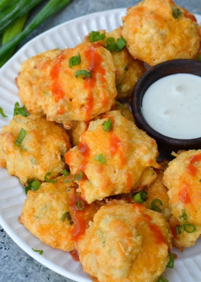 These Cheesy Buffalo Chicken Bites will be a new keto-friendly favorite! Cheesy almond flour bites are packed with spicy Buffalo Chicken for the perfect snack under 1 net carb! 