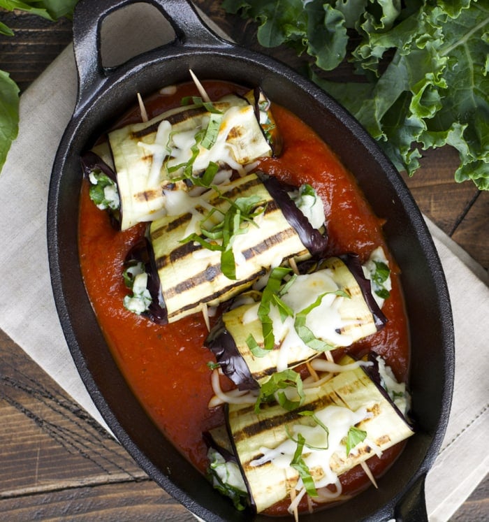 These Eggplant Rolls make a super easy vegetarian appetizer or dinner in just 30 minutes! Sliced eggplant is grilled and packed with a cheesy, Roasted Garlic Ranch and kale mixture!