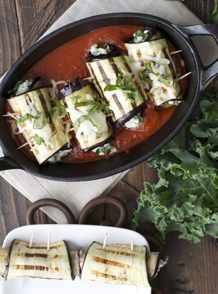Grilled and stuffed eggplant is filled with creamy, cheesy goodness and can be baked on a bed of marinara for a tasty appetizer or dinner!
