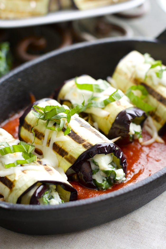These Eggplant Rolls make a super easy vegetarian appetizer or dinner in just 30 minutes! Sliced eggplant is grilled and packed with a cheesy, Roasted Garlic Ranch and kale mixture!