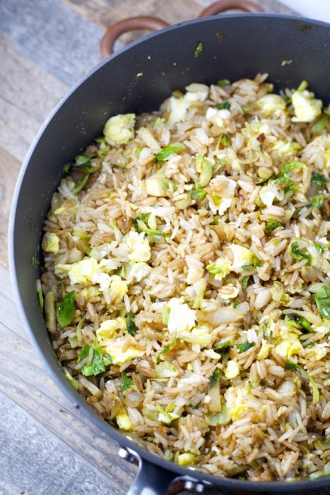 Thinly sliced Brussels Sprouts are paired with fried rice for the perfect healthy dinner! Super simple and ready in just 15 minutes!