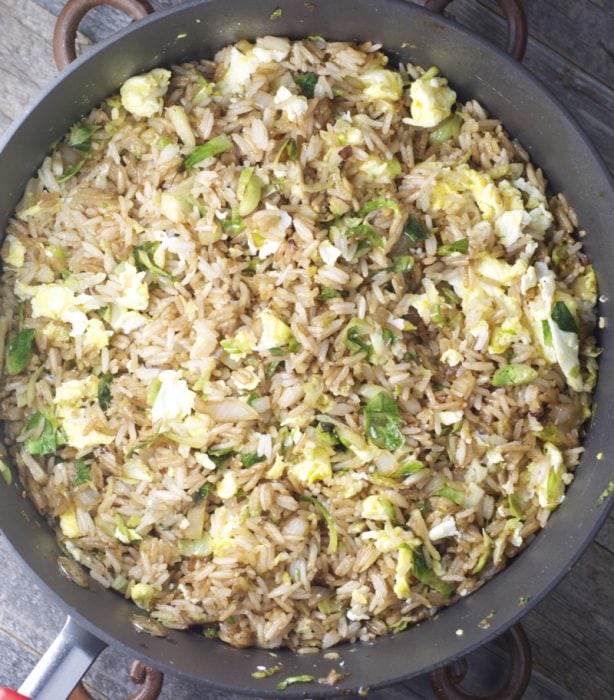 Thinly sliced Brussels Sprouts are paired with fried rice for the perfect healthy dinner! Super simple and ready in just 15 minutes!