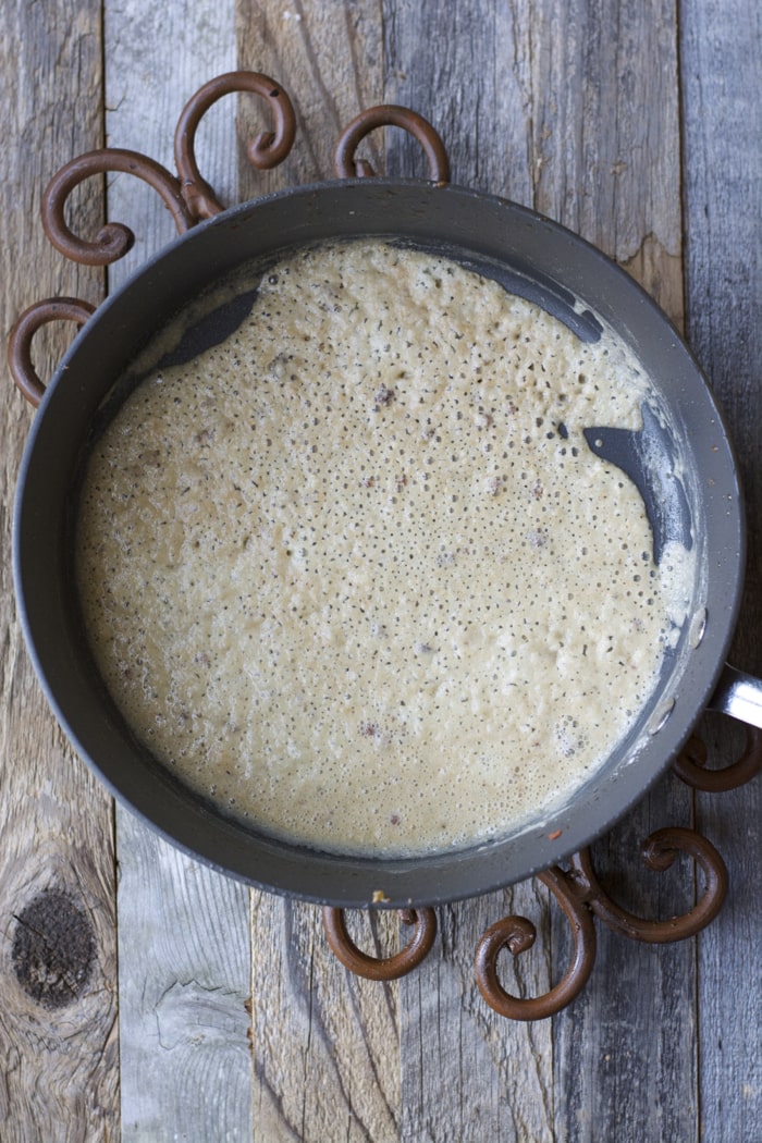 overhead view of saucepan with breakfast gravy in it