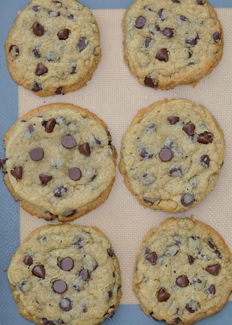 6 large gluten free chocolate chip cookies on a silicone baking mat