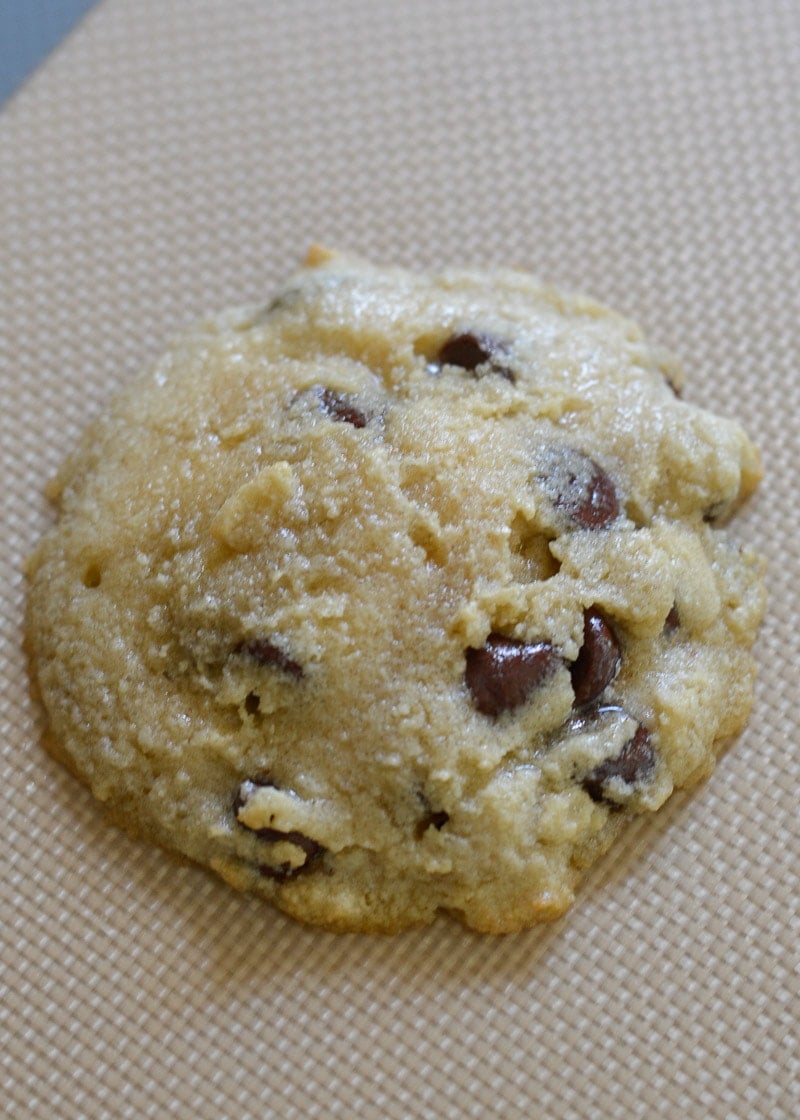 partially cooked gluten free cookie on a silicone baking sheet