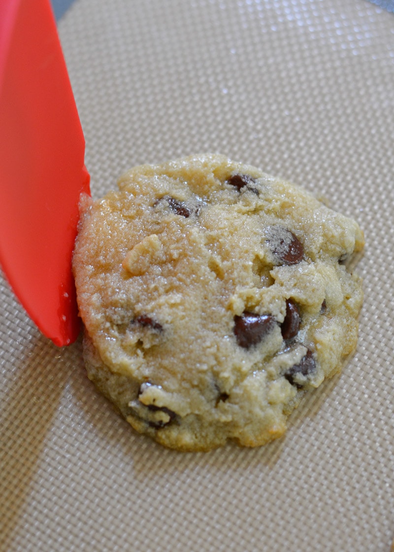 partially cooked gluten free cookies are shaped with a silicone spatula to provide more lift and chewy texture