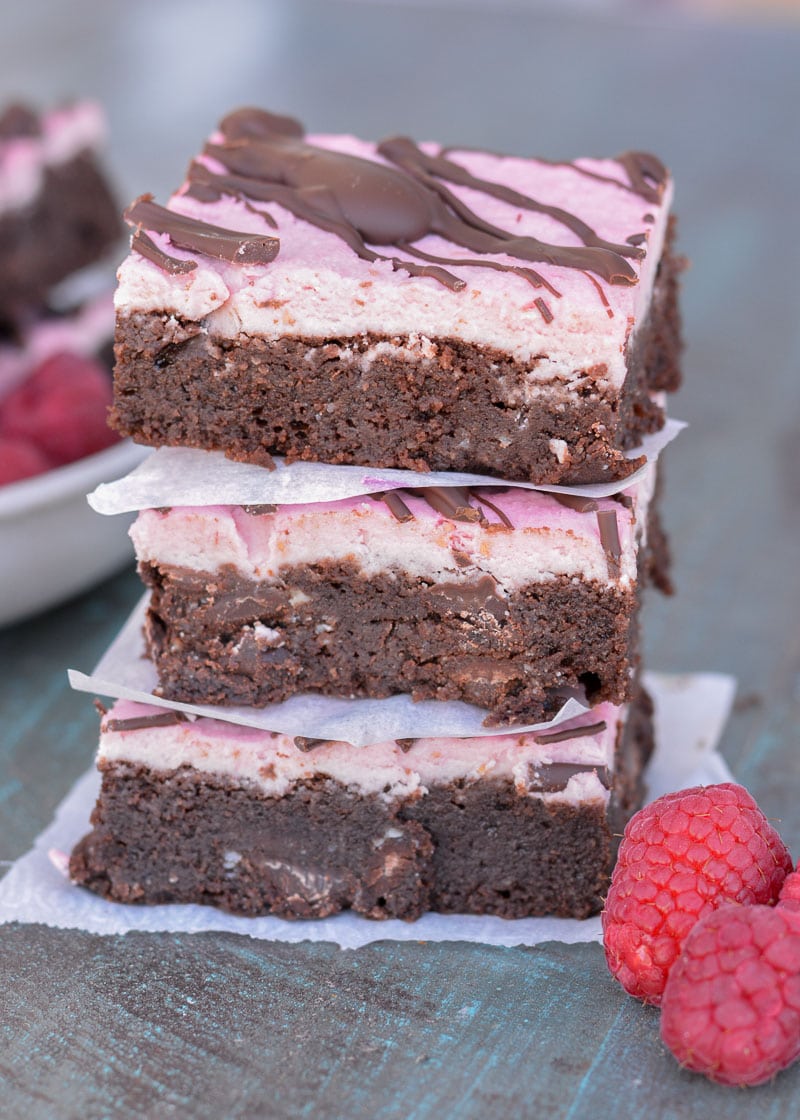 Enjoy these Keto Brownies with Frosting for a decadent sweet treat under 4 net carbs! Each grain free brownie is covered in Raspberry Frosting and rich dark chocolate. 