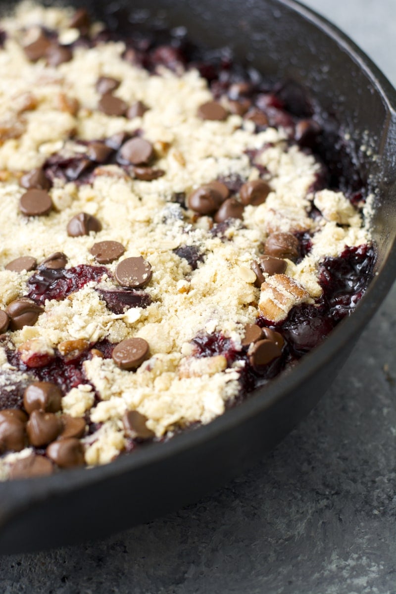 Close up of fresh cherry crisp in cast iron skillet