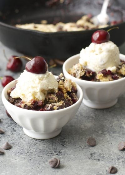 This Chocolate Covered Cherry Crisp is the ultimate Summer treat! Fresh cherries are topped with an chocolate chip oatmeal cookie crumb topping!